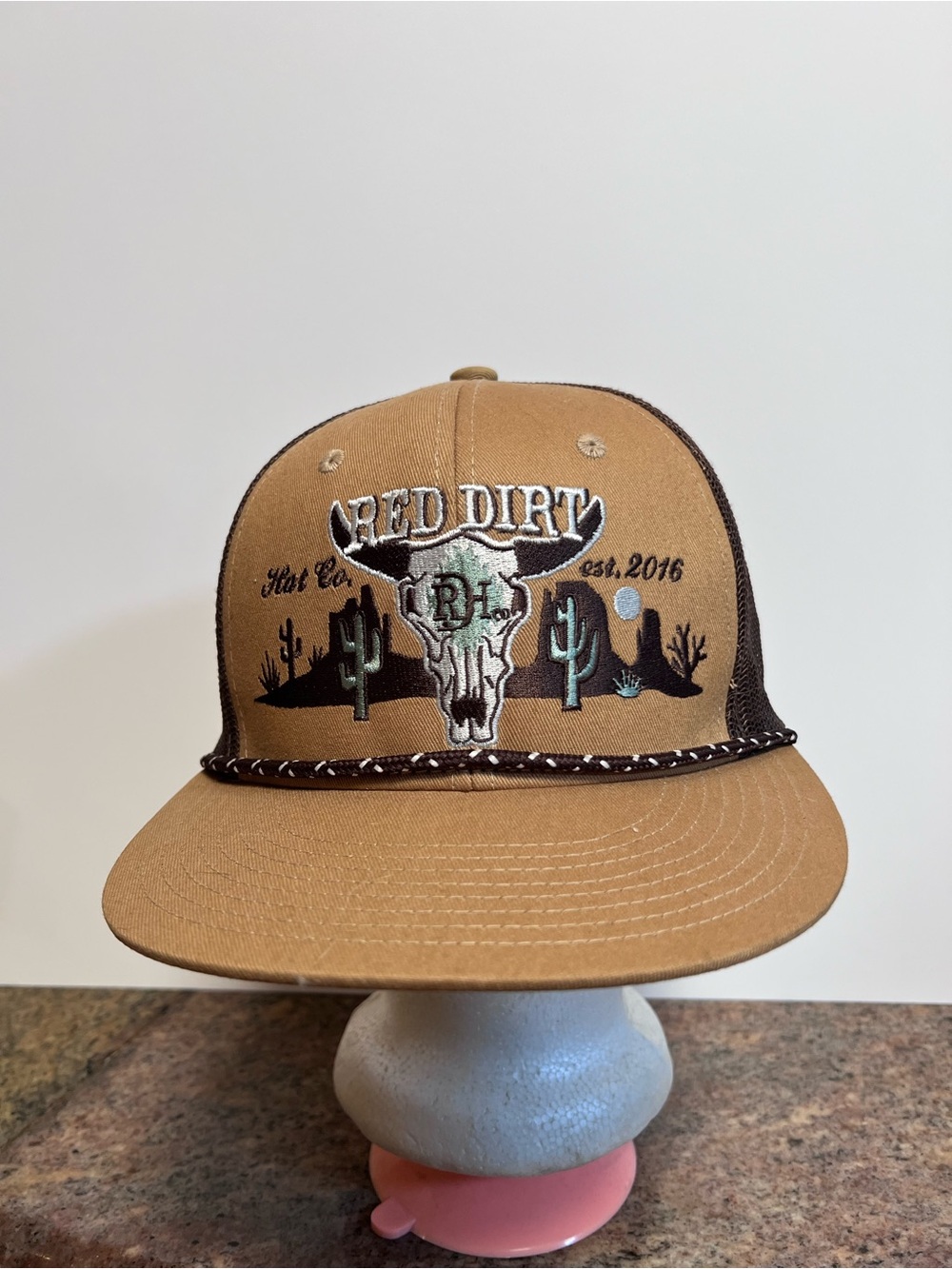 Tan Trucker Hat with Skull Logo